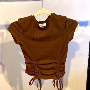 Brown top. New